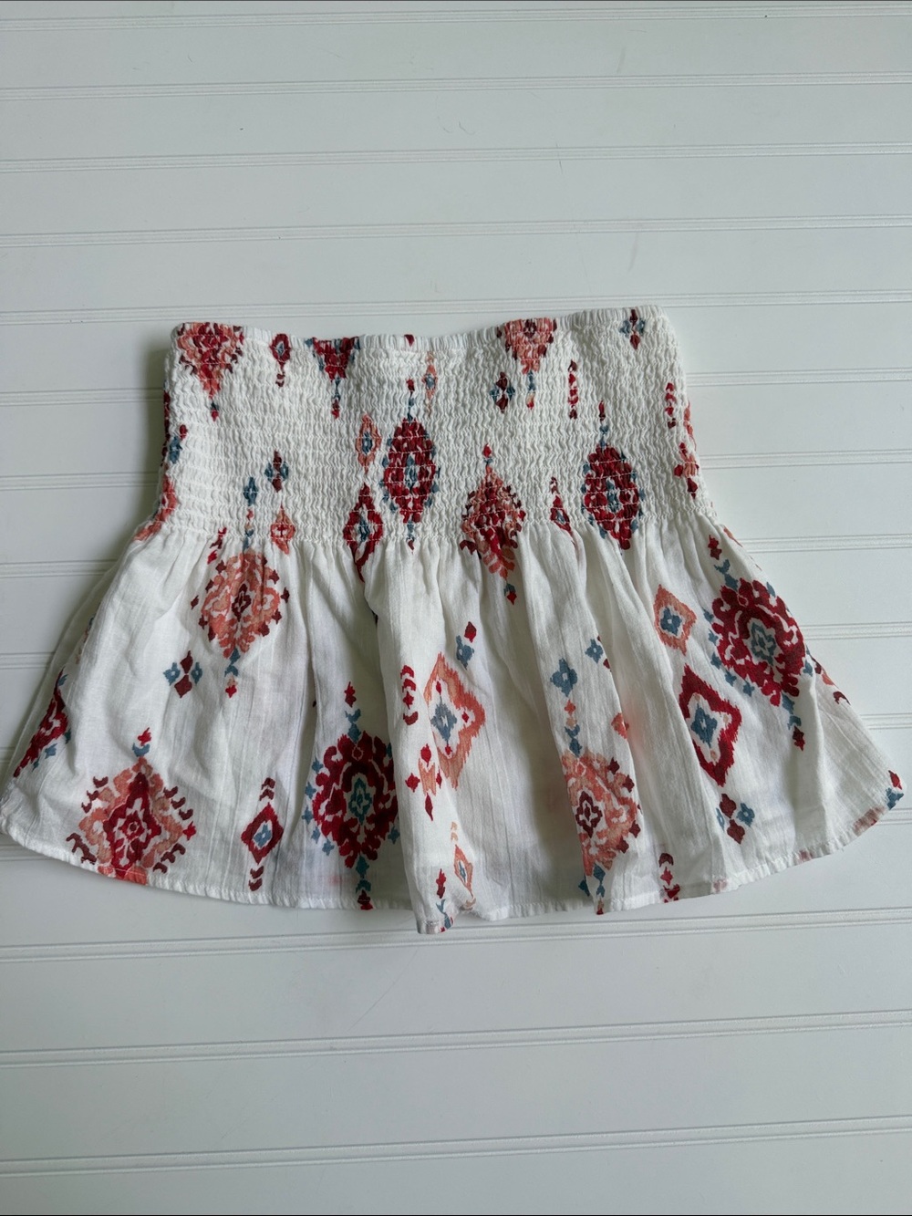 (338)American Eagle Outfitters White Smocked Tube Top wRed & Coral Aztec Print